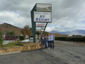 People standing in front of the resort’s signboard