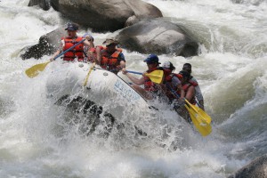 A group of people rafting on a river